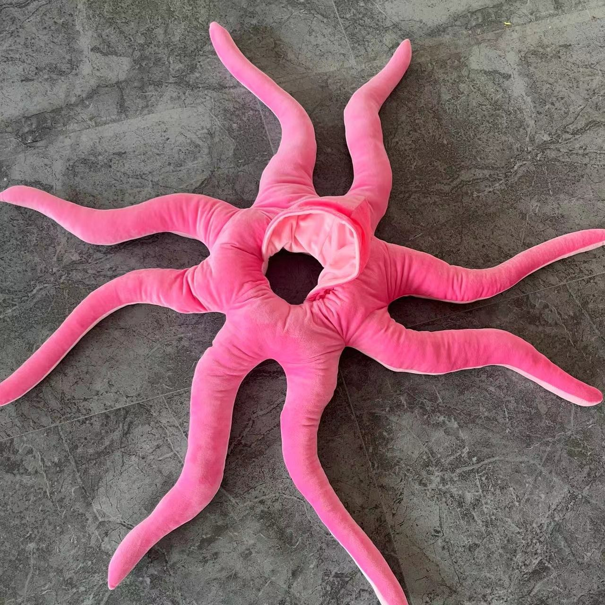 Pink Little Octopus Costume laid flat with eight padded tentacles